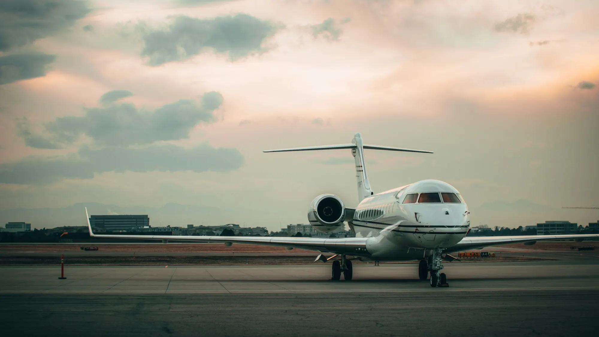 Business jet on a wide ramp at dusk